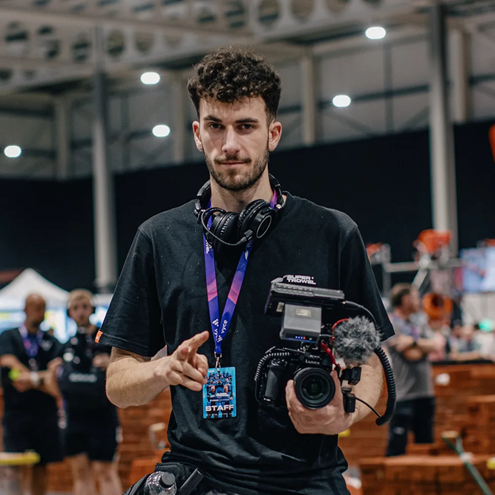 Josh, founder of Astrokid Studios, holding a camera at a Super Trowel event